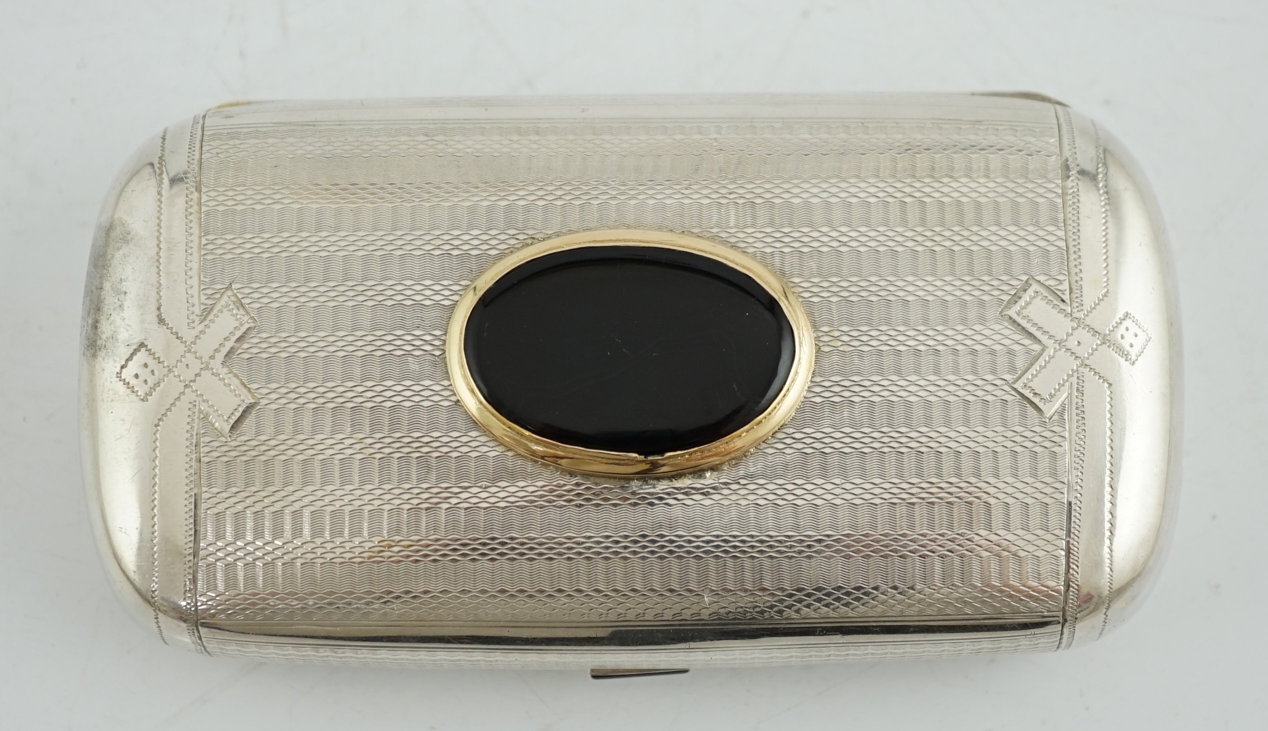 A late 19th Russian part engine turned 84 zolotnik silver and oval black agate inset oval cigar case, master Karl Verlin